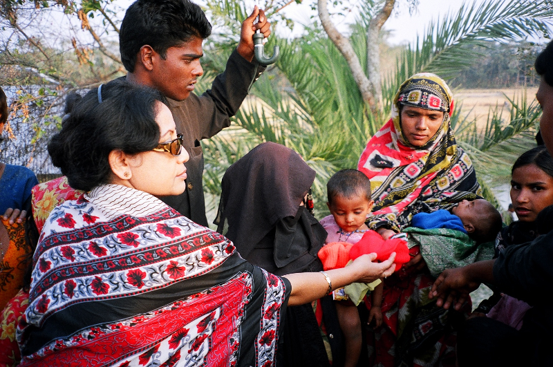unv-shahida-akhter-distributing-relief-to-the-victims-of-cyclone-in-a-coastal-district-in-bangladesh